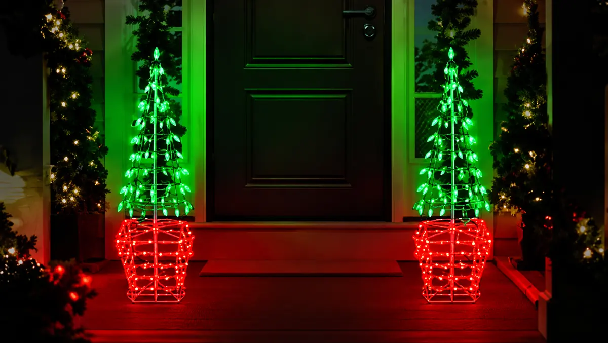 Illuminated topiary tree-inspired Christmas decoration featuring LED lighting.